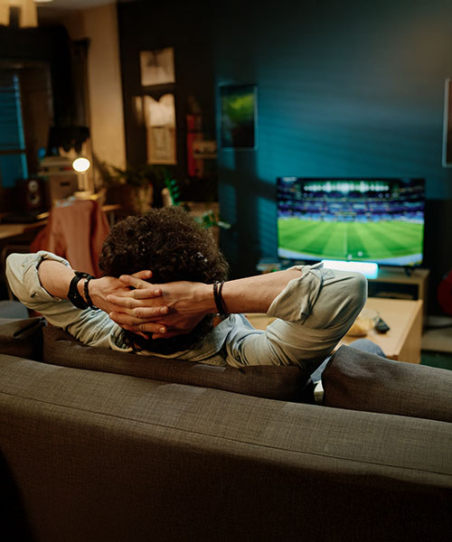 man watching sports on tv mobile