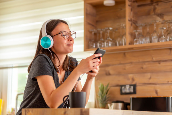 woman streaming music on phone